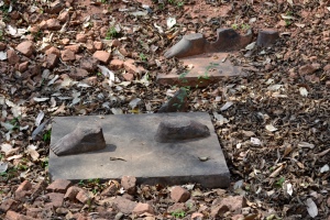 The feet of two ancient sandstone statues were left behind by looters at a temple in Koh Ker, Cambodia. One statue is now at Sotheby's, the other at the Norton Simon Museum in Pasadena.